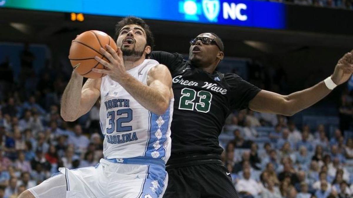 North Carolinas Luke Maye (32) drives against Tulanes Blake Paul (23) during the second half on Sunday, Dec. 3, 2017, at the Smith Center in Chapel Hill.