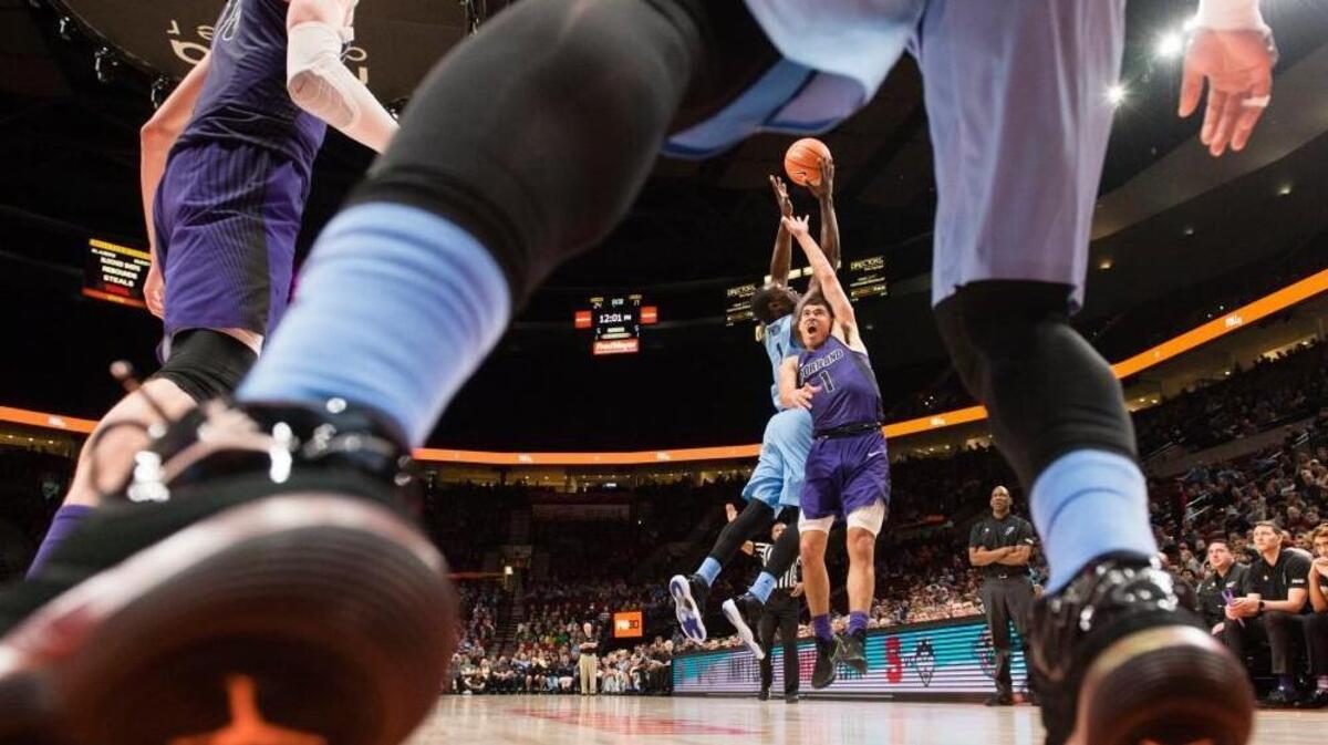 North Carolina forward Theo Pinson, left, and Portland guard Malcolm Porter, right, battle for an inbound pass during the first game of the PK80 on Thursday.