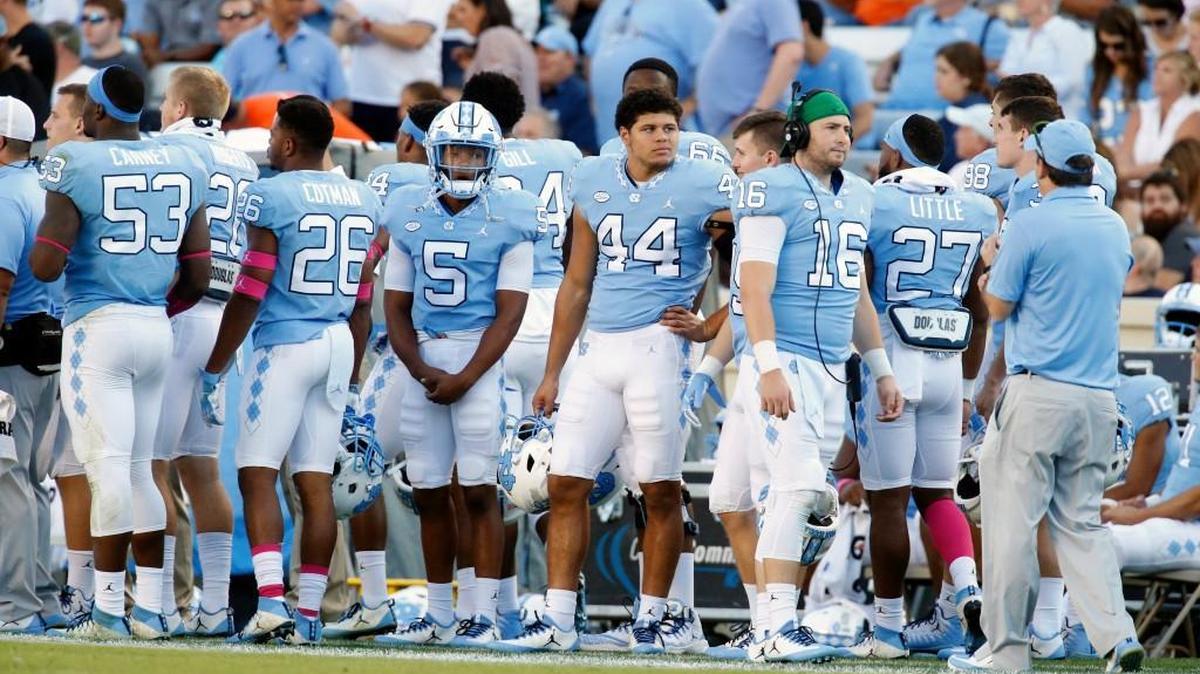 UNC players react after a turnover during the Tar Heels’ 20-14 loss to Virginia on Oct. 14.