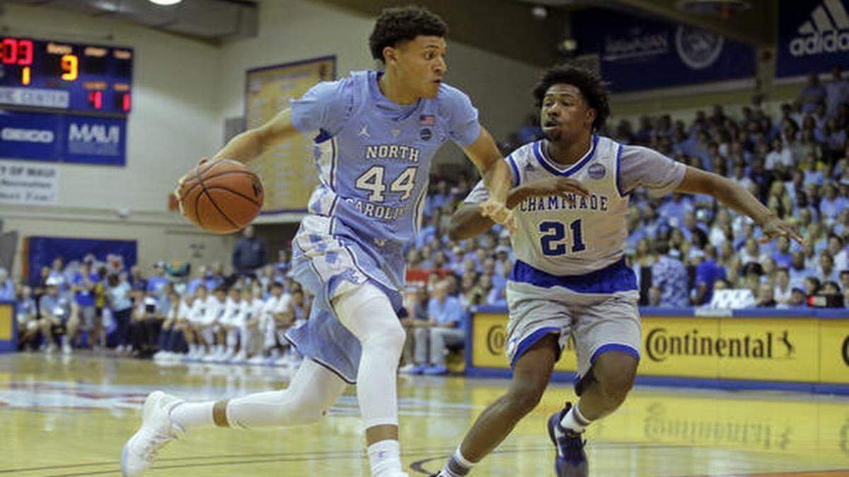 North Carolina forward Justin Jackson (44) drives around Chaminade guard Rohndell Goodwin (21) in the first half during an NCAA college basketball game in the Maui Invitational, Monday, Nov. 21, 2016, in Lahaina, Hawaii.