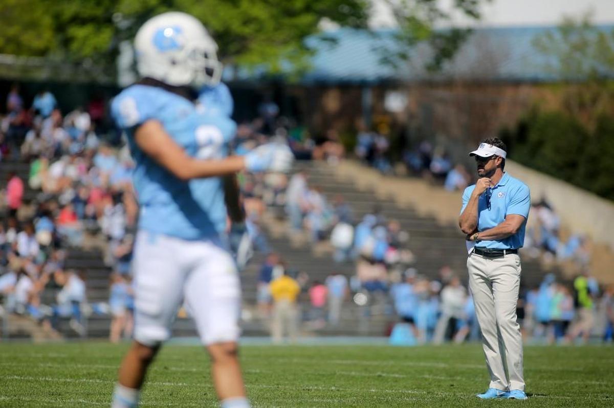 North Carolina coach Larry Fedora, right, watches as the spring game begins in April.