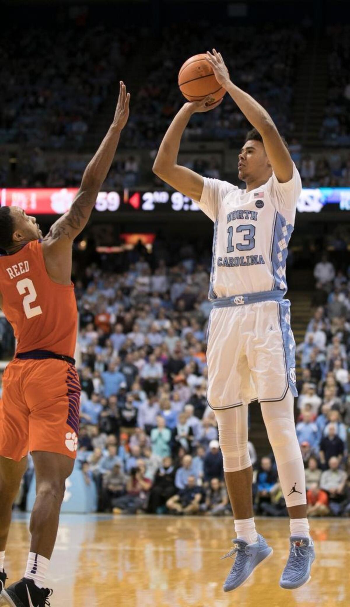North Carolina’s Cameron Johnson (13) takes a shot over Clemson’s Marcquise Reed (2) during the second half on Tuesday, January 16, 2018 at the Smith Center in Chapel Hill.