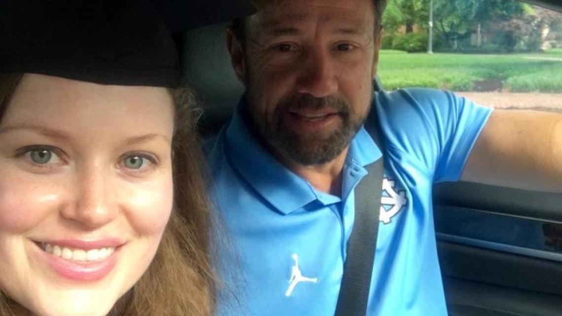 UNC coach Larry Fedora with Scarlett Murphy, a UNC medical school graduate, after Fedora helped her with a ride on graduation day.