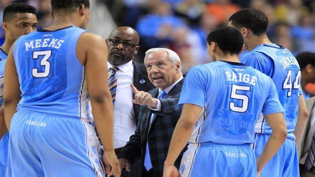 
UNC head coach Roy Williams talks to his team including Kennedy Meeks (3), Marcus Paige (5) and Justin Jackson (44) during a timeout in the second half of North Carolina's 71-67 victory over Virginia in the semifinals of the 2015 New York Life ACC Tournament at the Greensboro Coliseum in Greensboro, N.C., Friday, March 13, 2015.
