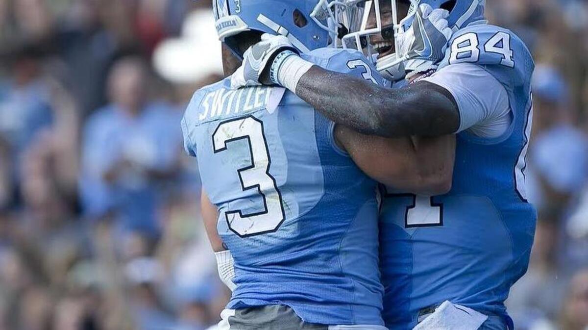 North Carolin’s Bug Howard (84) celebrates with Ryan Switzer (3) following a 12 yard pass completion from quarterback Mitch Trubisky to give the Tar Heels a 35-21 lead in the second quarter on Saturday, September 17, 2016 at Kenan Stadium in Chapel Hill, N.C.