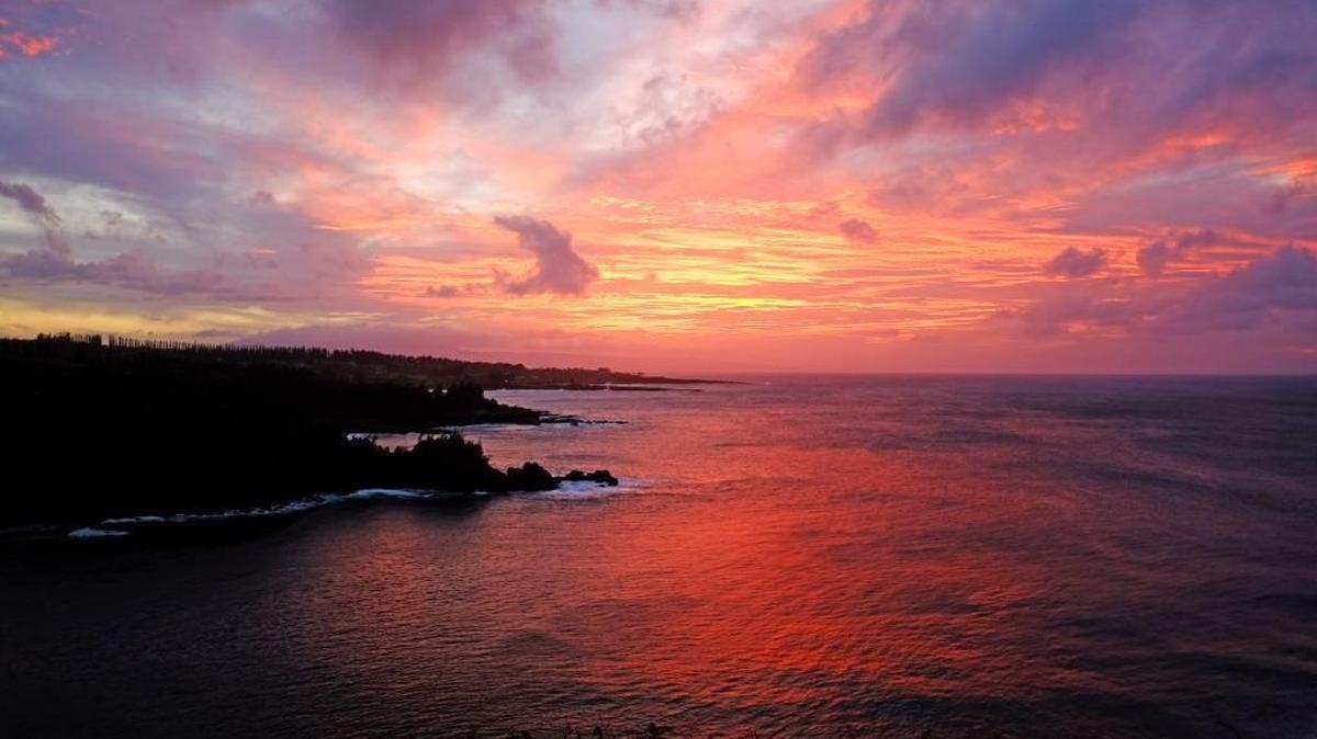 The sun sets on Sunday over the Honolua Bay off the island of Maui, in Hawaii.