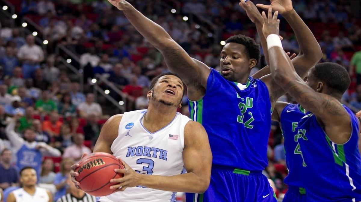 North Carolina’s Kennedy Meeks muscles his way to the basket against Florida Gulf Coast’s Antravious Simmons during the Tar Heels’ victory in the first round of the NCAA Tournament on Thursday, March 17.