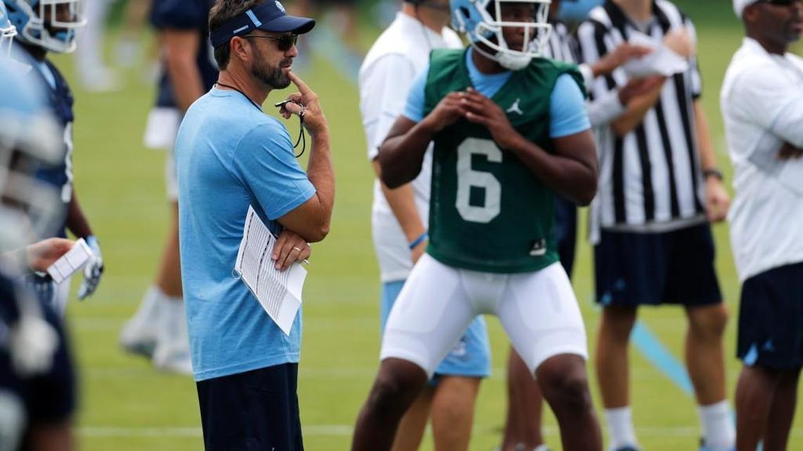 UNC coach Larry Fedora watches quarterback Brandon Harris during a drill at practice on Aug. 2.