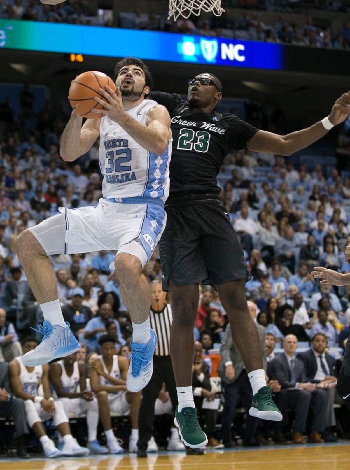 North Carolina’s Luke Maye (32) drives against Tulane’s Blake Paul (23) during the second half on Sunday, December 3, 2017 at the Smith Center in Chapel Hill, N.C. e.