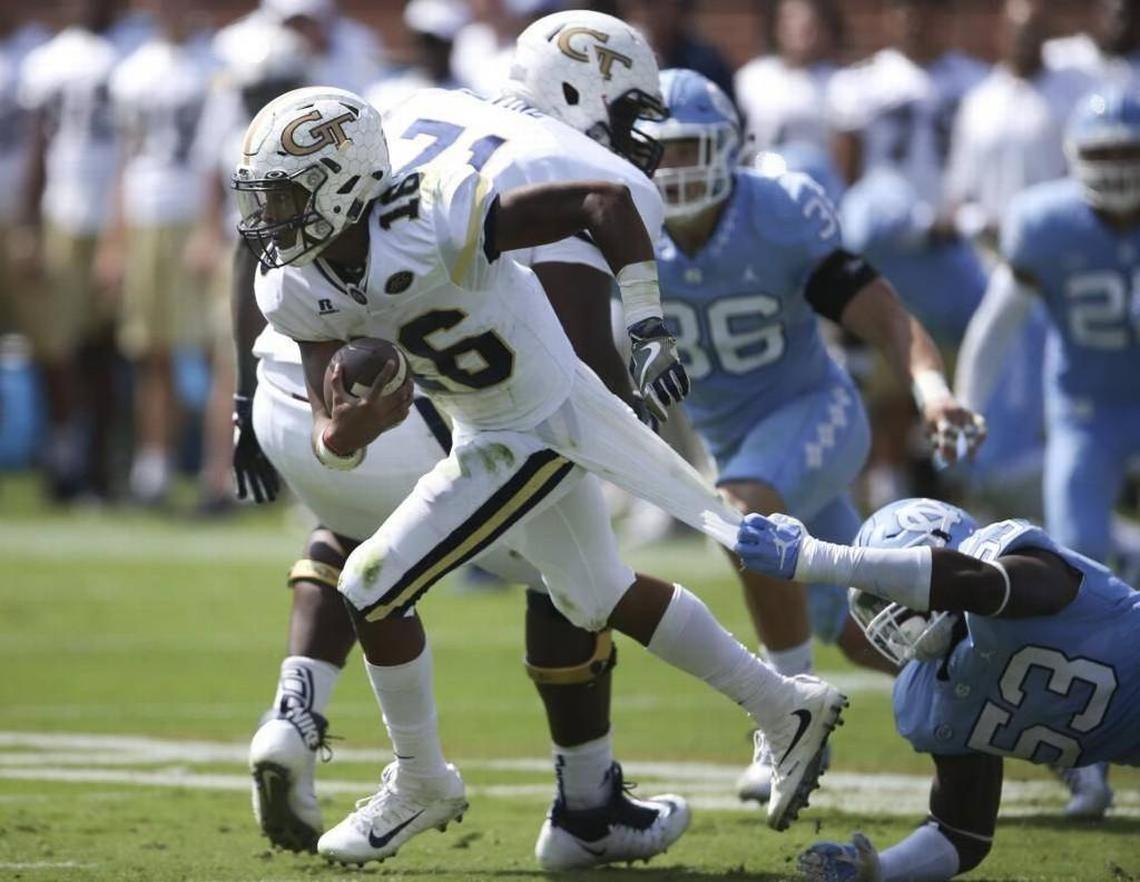 Georgia Tech quarterback TaQuon Marshall (16) breaks free from North Carolina defensive end Malik Carney (53) in the first half of the Yellow Jackets’ 33-7 victory on Saturday at Bobby Dodd Stadium.