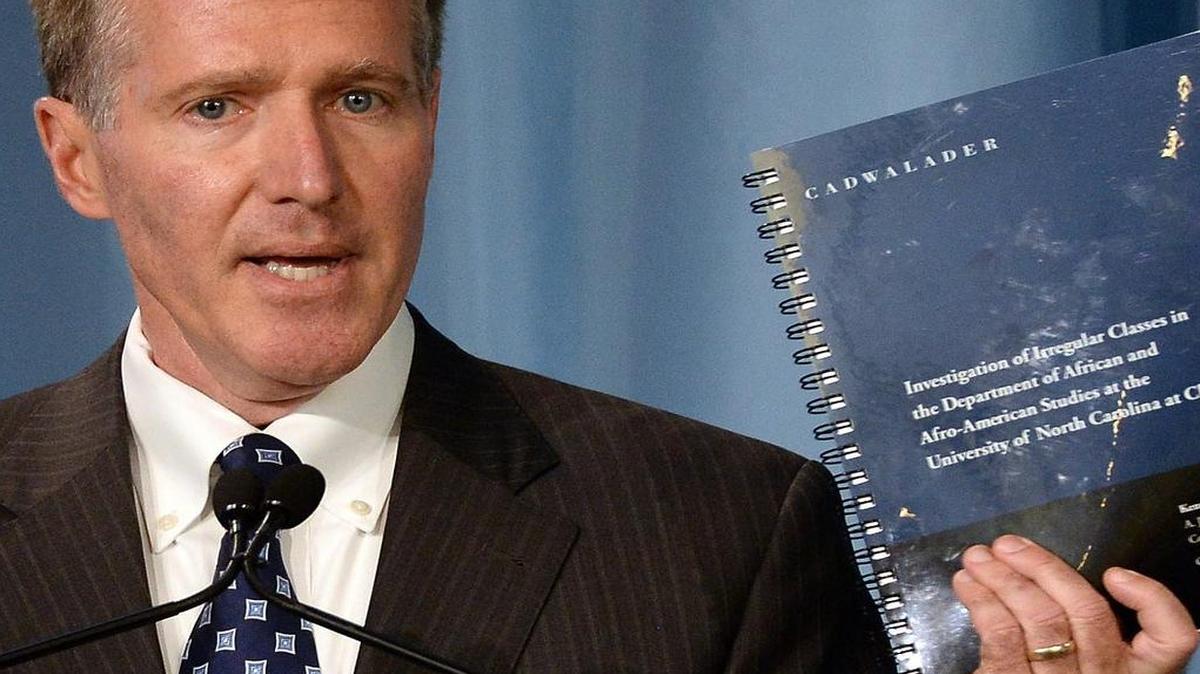 
Kenneth Wainstein, a partner with Cadwalader, Wickersham & Taft LLP holds up the report on UNC-Chapel Hill's academic problems in association with the athletics department during a press conference at Chapel Hill, NC Wednesday, October 22, 2014.
