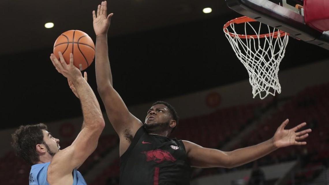 North Carolina's Luke Maye (32) gets a shot off past Arkansas' Trey Thompson in the first half of an NCAA college basketball game during the Phil Knight Invitational tournament in Portland, Ore., Friday, Nov. 24, 2017. (AP Photo/Timothy J. Gonzalez)