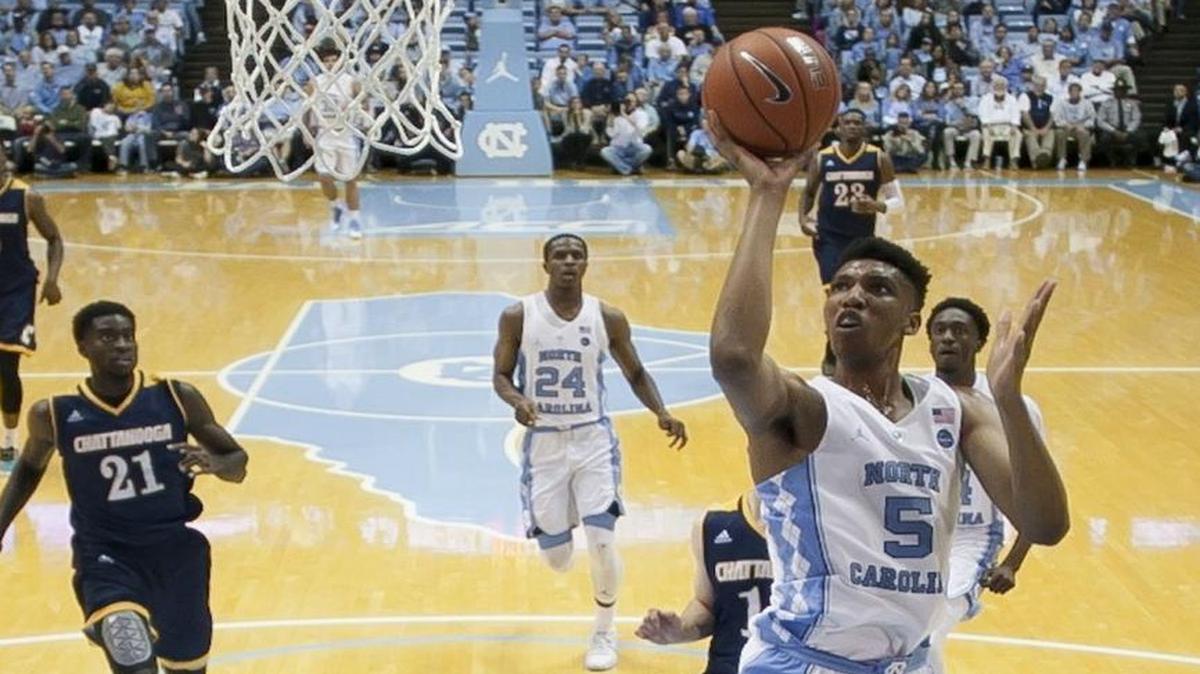 North Carolina’s Tony Bradley puts up a shot over Chattanooga’s Greg Pryor (1) during the second half at the Smith Center in Chapel Hill. Bradley scored 12 points in the Tar Heels’ 97-57 victory.