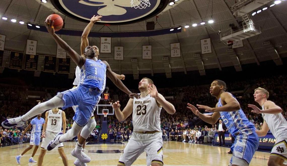 North Carolina's Theo Pinson (1) drives to the basket against Notre Dame's Martinas Geben (23) during the second half. Pinson scored 13 points in the Tar Heels' victory.