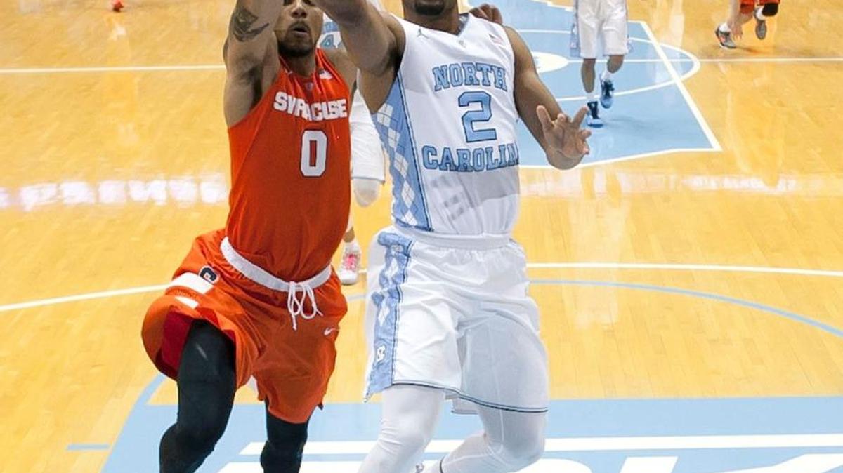North Carolina’s Joel Berry II (2) drives to the basket as Syracuse’s Michael Gbinije (0) defends in the first half on Monday, February 29, 2016 at the Smith Center. Berry II scored 13 points in the Tar Heels’ 75-70 victory over Syracuse.