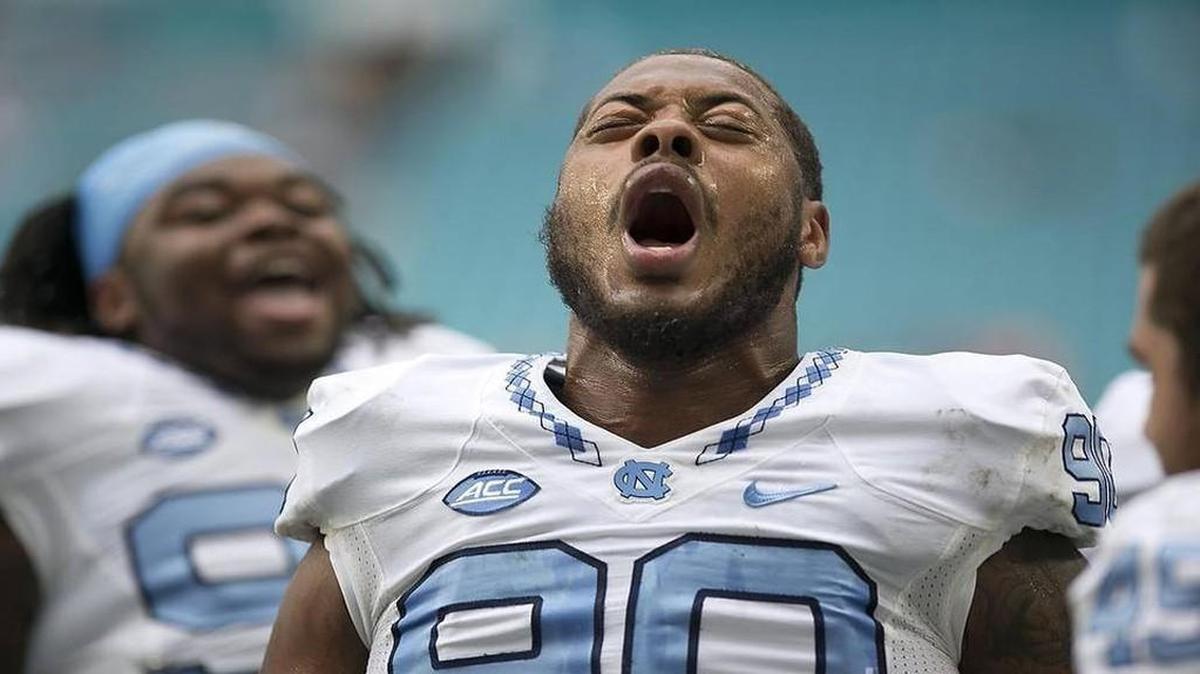 UNC defensive tackle Naz Jones leads a yell with his teammates before the Tar Heels’ victory at Miami on Saturday. Jones and his defensive teammates played their best game of the season.