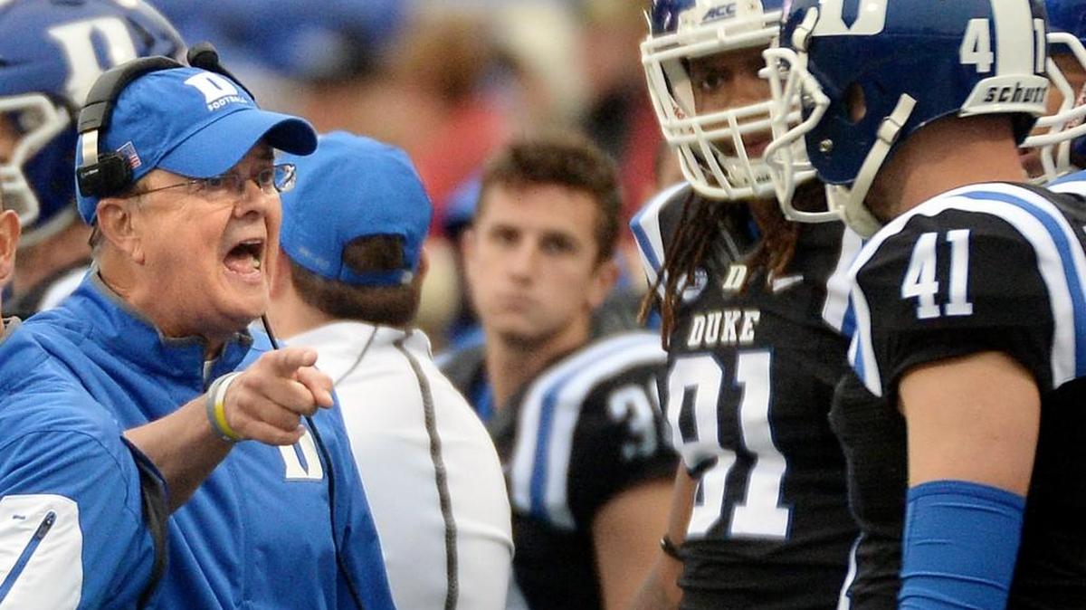Duke coach David Cutcliffe, left, talks to punter Will Monday on Oct. 3 at Boston College. Virginia Tech head coach Frank Beamer says he’s impressed with the job Cutcliffe has done at Duke. The No. 23 Blue Devils face the Hokies in Blacksburg on Saturday.