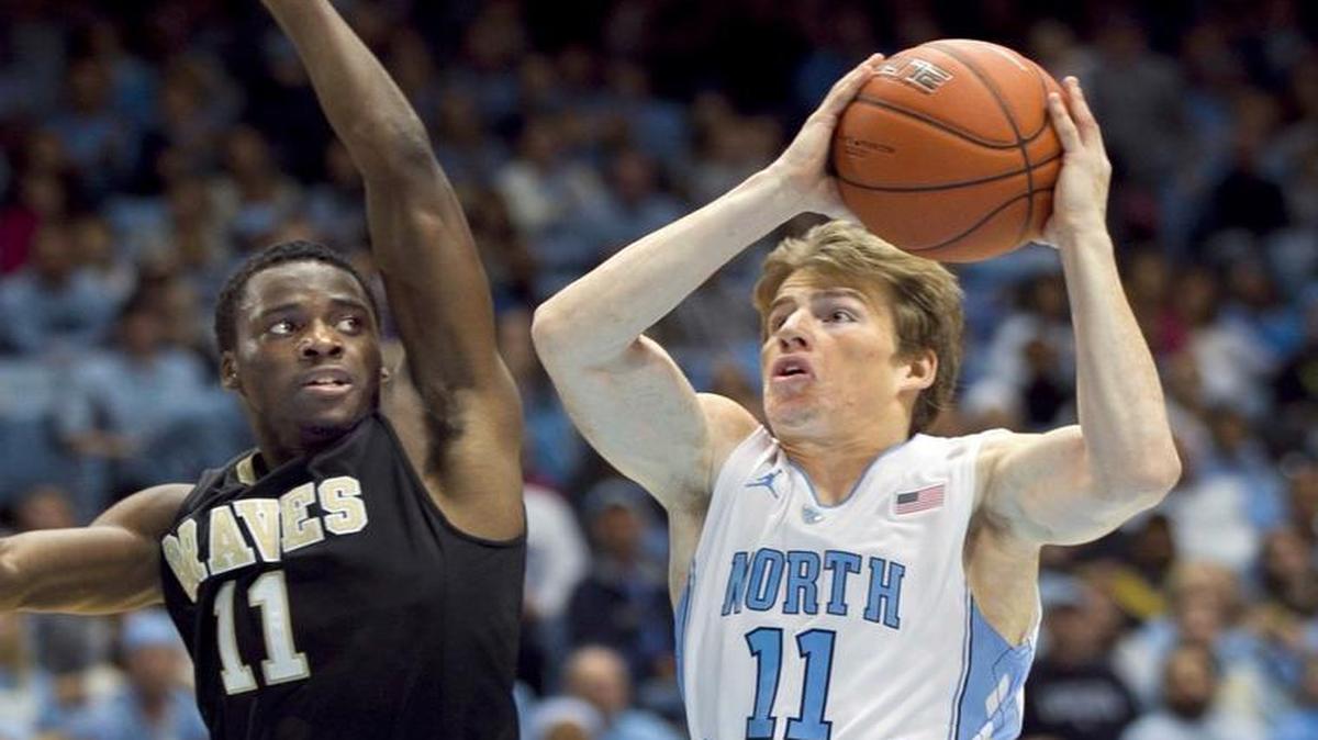 UNC's Stilman White (11) drives to the basket against defends UNC-Pembroke's Griffin Pittman (11) in the first half on October 28, 2011 at the Smith Center in Chapel Hill, N.C.