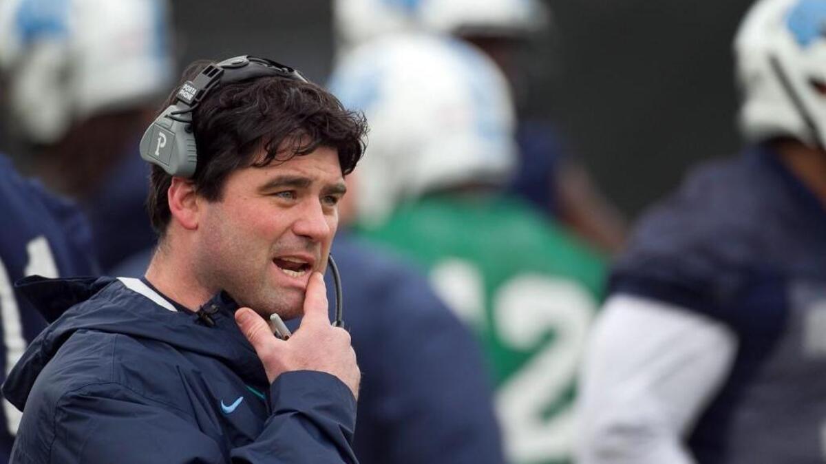 UNC offensive coordinator Seth Littrell sizes up the talent during the Tar Heels' first day of practice on Wednesday, March 5, 2014, at Navy Field in Chapel Hill.