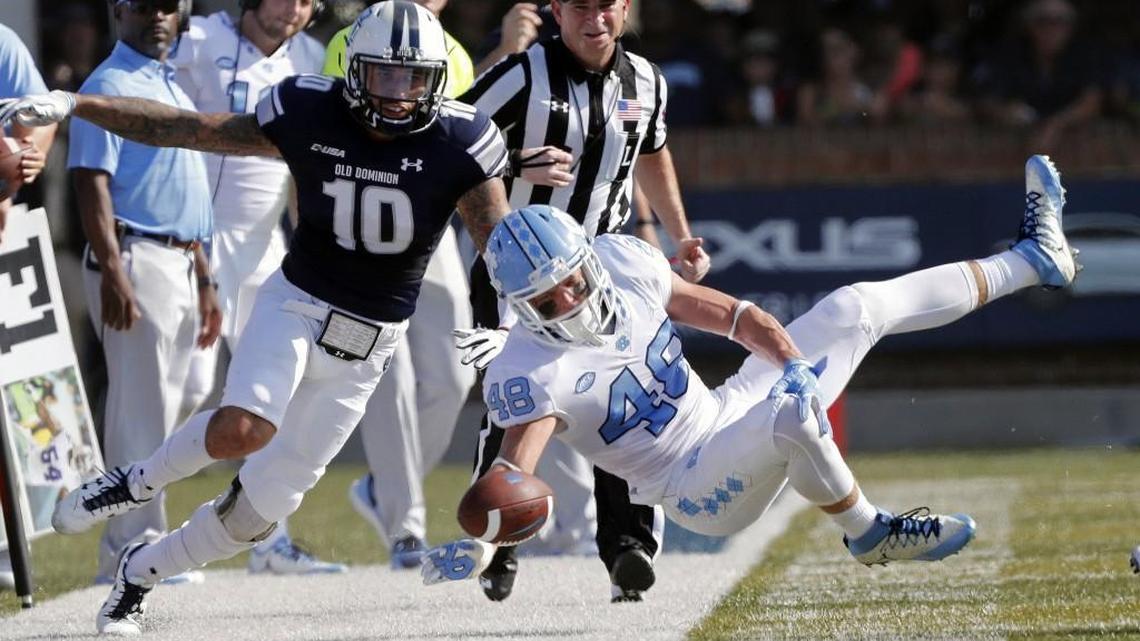 UNC's Thomas Jackson (48) flies through the air as he is upended by ODU's Andre Bernhard (10) during the first quarter against the Old Dominion Monarchs at S.B. Ballard Stadium in Norfolk, Va., on Sept. 16, 2017.