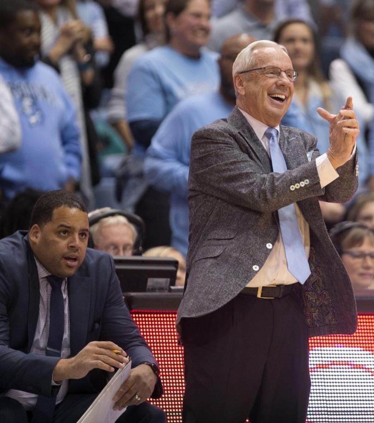 North Carolina coach Roy Williams cracks a smile as he applauds his team’s performance during the closing minutes of the Tar Heels game against Clemson on Tuesday, January 16, 2018 at the Smith Center in Chapel Hill, N.C.