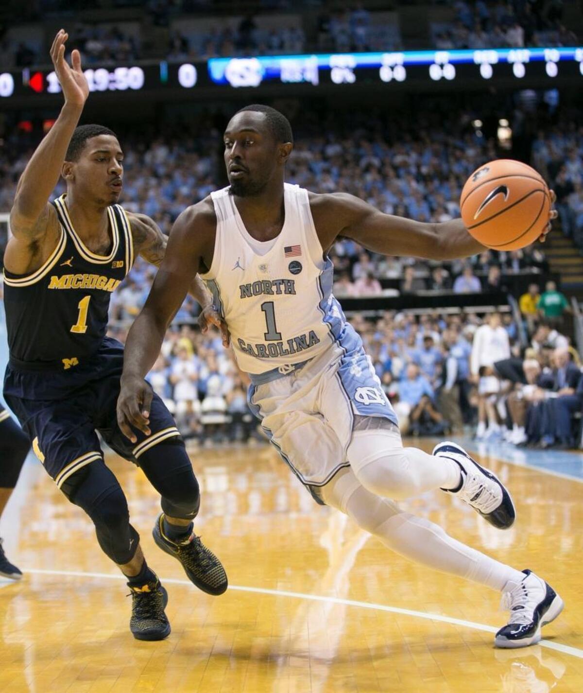 North Carolina’s Theo Pinson (1) drives to the basket against Michigan’s Charles Matthews (1) during the first half on Wednesday, November 29, 2017 at the Smith Center in Chapel Hill, N.C.