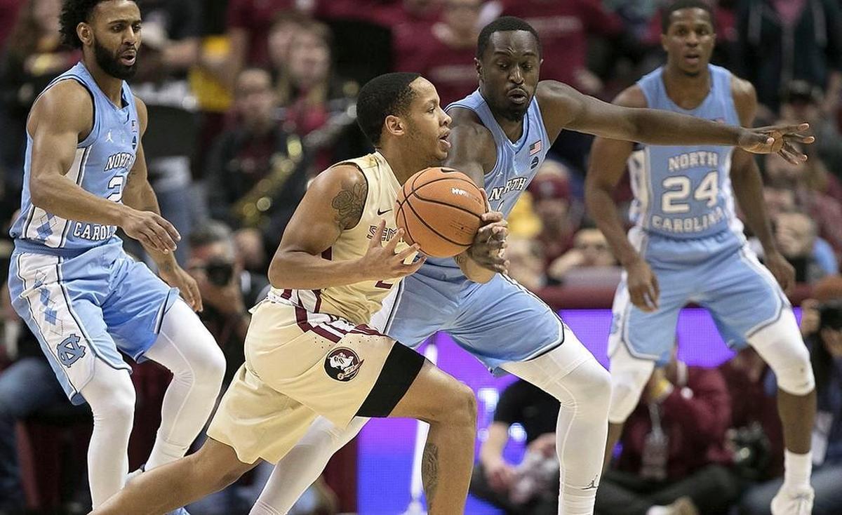North Carolina’s Theo Pinson (1) tries for a steal from Florida State’s C.J. Walker (2) during the first half on Wednesday, January 3, 2018 at the Tucker Civic Center in Tallahassee, Fla.