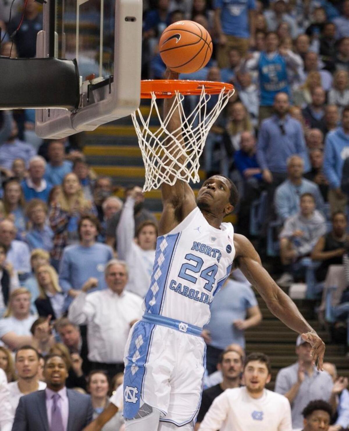 North Carolina’s Kenny Williams (24) breaks to the basket for a dunk on a fast break during the second half against Wake Forest on Saturday, December 30, 2017 at the Smith Center in Chapel Hill, N.C. Williams had 13 points in the Tar Heels’ win over Wake Forest.