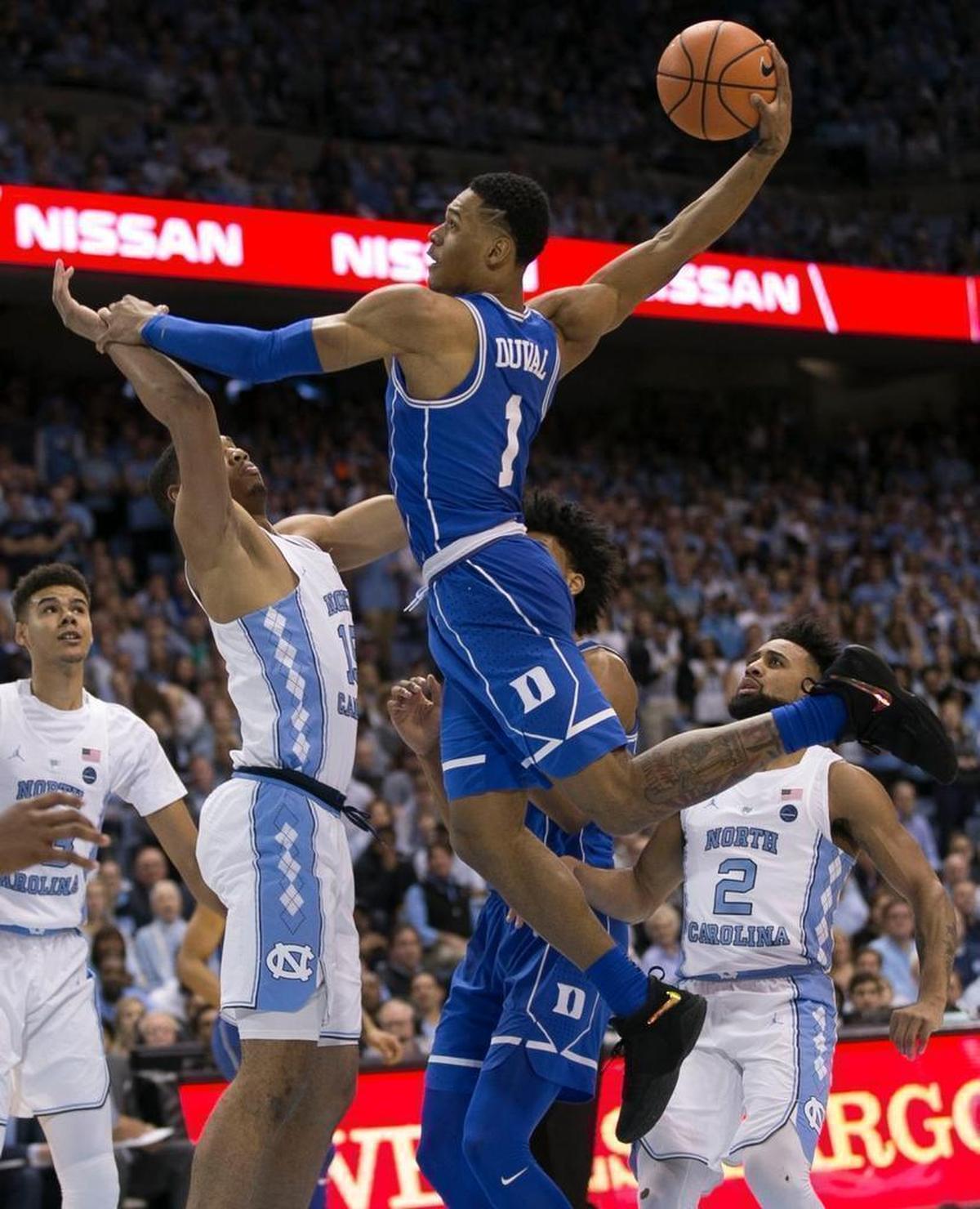 Dukes Trevor Duval (1) drives to the basket for a dunk over North Carolinas Garrison Brooks (15) during the first half against Duke on Thursday, February 8, 2018 at the Smith Center in Chapel Hill, N.C.
