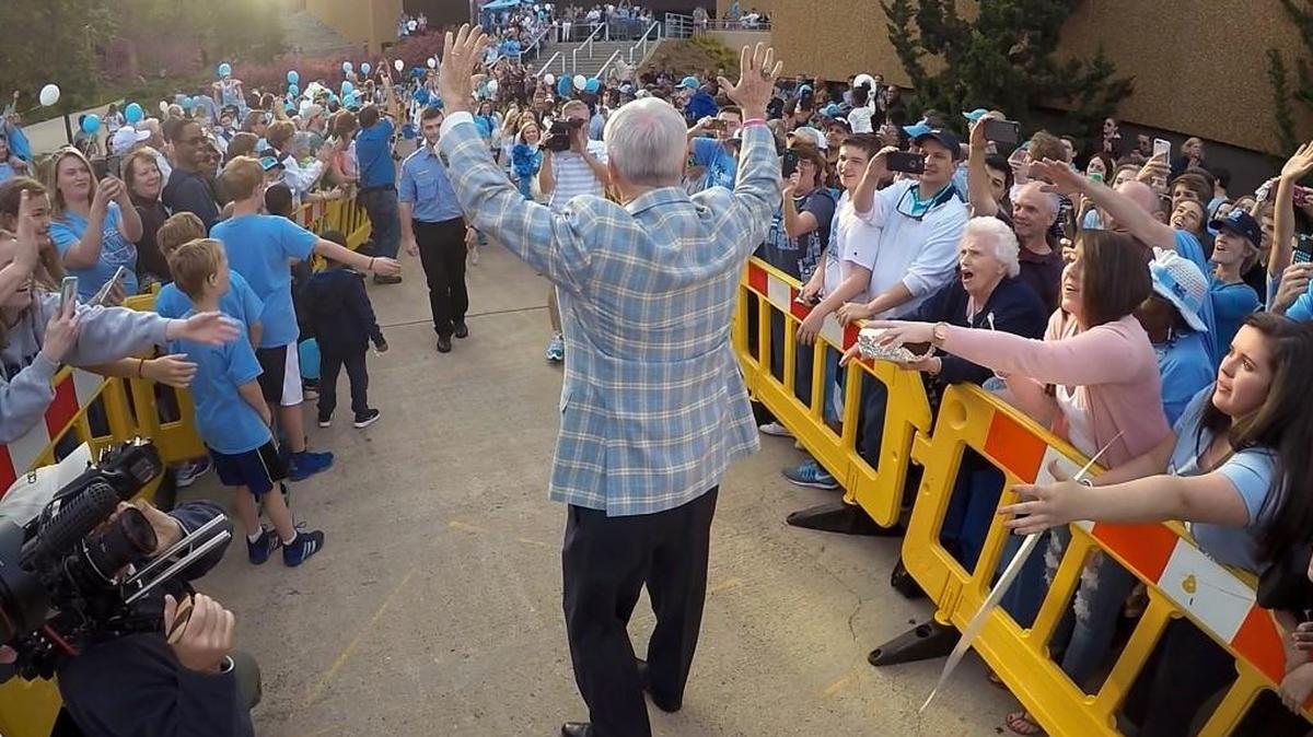 Tar Heel head coach Roy Williams slaps hands with fans at the Smith Center on the campus of UNC-Chapel Hill in Chapel Hill, N.C. Wednesday, March 30, 2016.