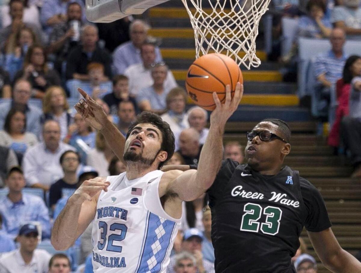 North Carolina’s Luke Maye (32) puts up a shot against Tulane’s Blake Paul (23) during the second half on Sunday, December 3, 2017 at the Smith Center in Chapel Hill, N.C. Maye lead North Carolina with 22 points in their 97-73 victory over Tulane.