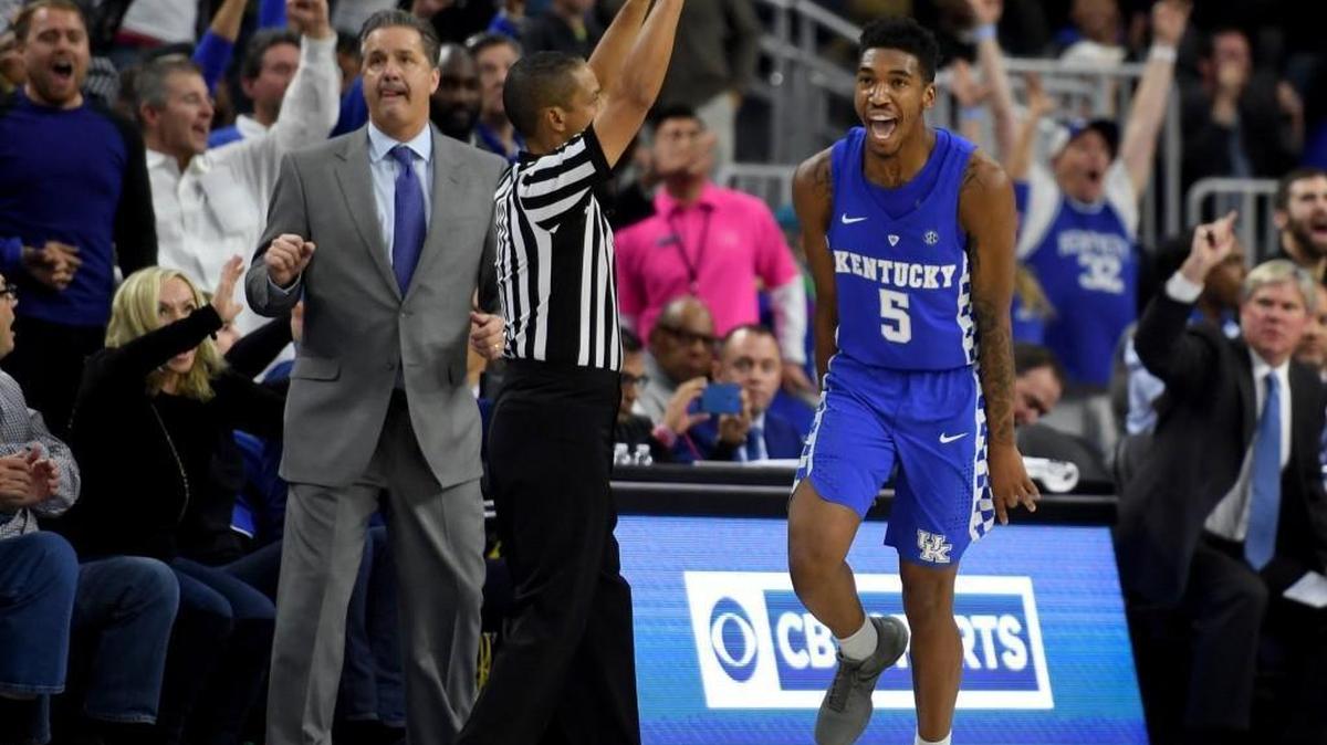 Kentucky coach John Calipari looks on as Malik Monk celebrates after hitting a go-ahead 3-pointer late in the team's 103-100 win over North Carolina.
