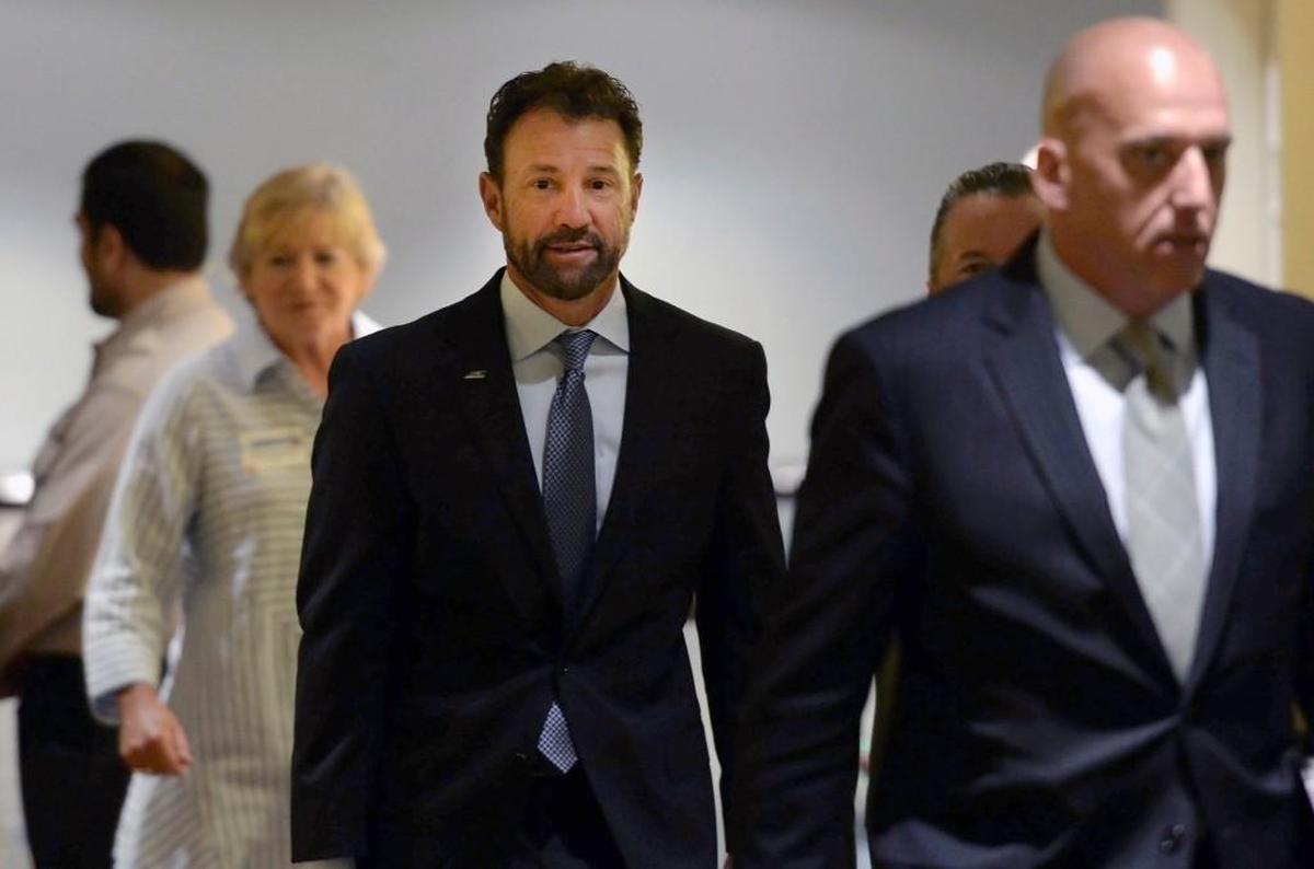 North Carolina football coach Larry Fedora, center, and women’s basketball coach Sylvia Hatchell, left, arrive at an NCAA hearing on Wednesday. It has taken more than two years for North Carolina to appear before an NCAA infractions committee panel since initially being charged with five top-level violations amid its long-running academic scandal.