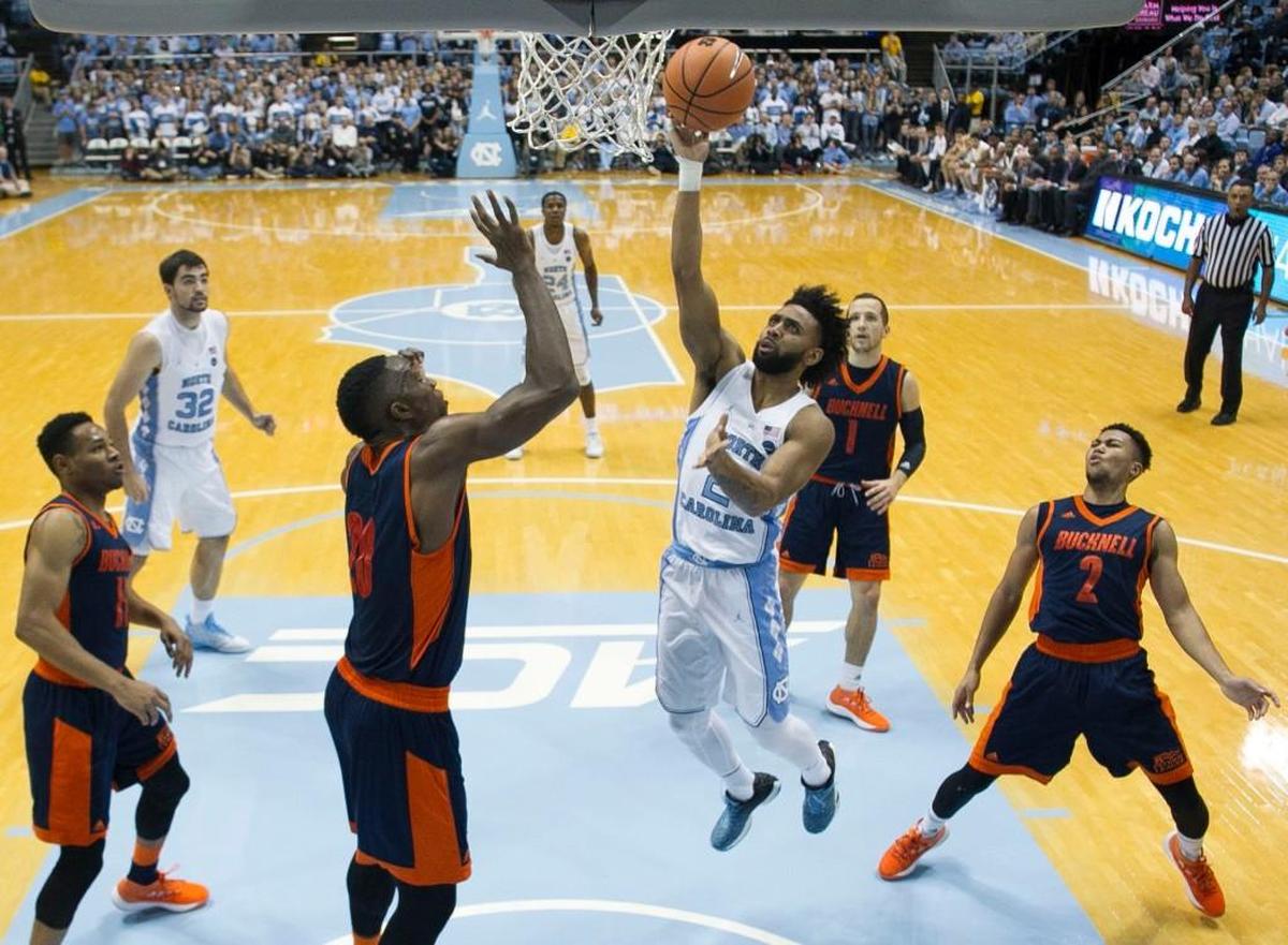 North Carolina’s Joel Berry II, middle, drives to the basket against Bucknell’s Nana Foulland, middle left, on Nov. 15.