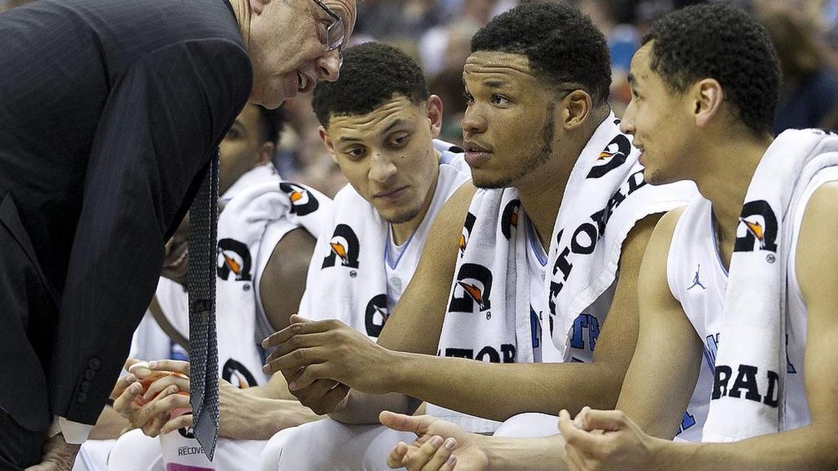 North Carolina coach Roy Williams talks with players Justin Jackson (44), Kennedy Meeks (3) and Marcus Paige (5) after taking them out of the game in the second half.