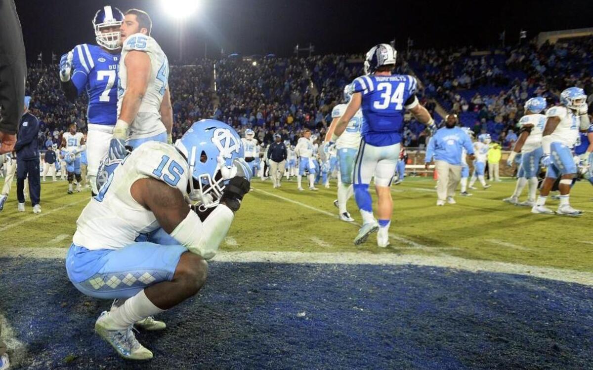 North Carolina safety Donnie Miles (15) reacts to the Blue Devils upsetting the Tar Heels 28-27 at Walllace Wade Stadium.