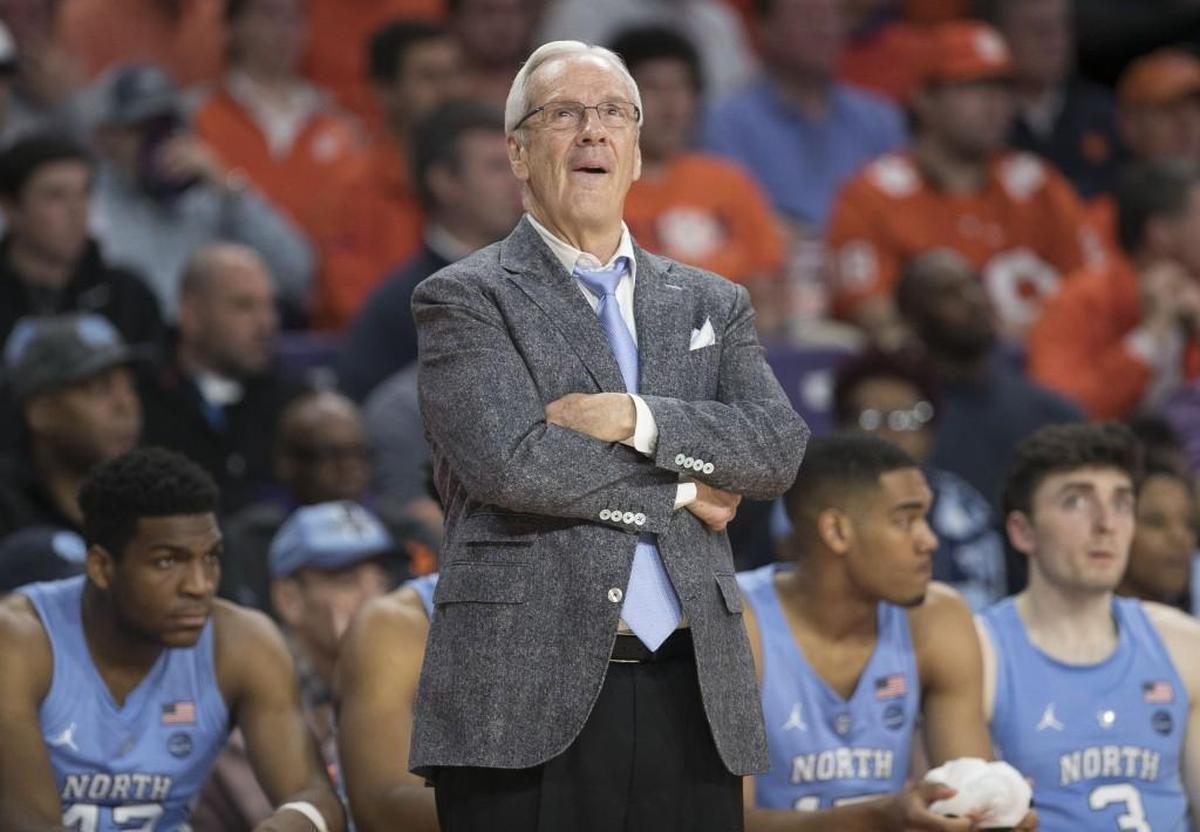 North Carolina coach Roy Williams checks the scoreboard as North Carolina cuts into the Clemson lead in the second half on January 30, 2018 at Littlejohn Coliseum inn Clemson, S.C.