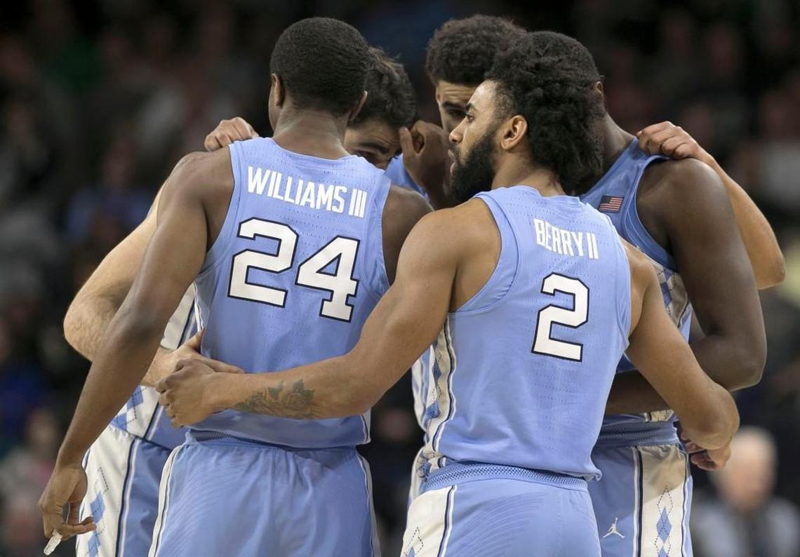 The Tar Heels' starting lineup, Joel Berry II (2), Kenny Williams (24), Theo Pinson (1), Luke Maye (32) and Cameron Johnson (13) huddle before the start of their game against Notre Dame.