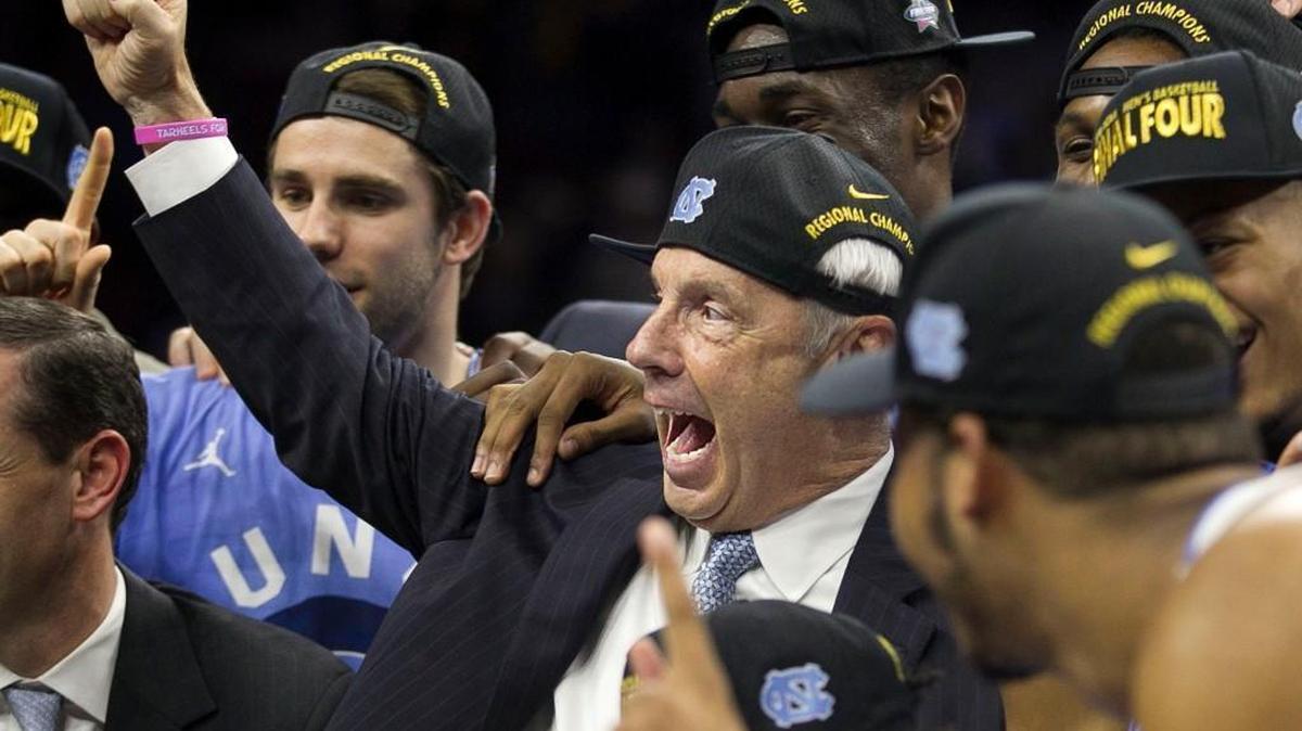 North Carolina coach Roy Williams celebrates the Tar Heels’ 88-74 victory over Notre Dame in the 2016 NCAA East Regional Final. Williams, who had knee replacement surgery in May, has been rehabbing while traveling this summer.