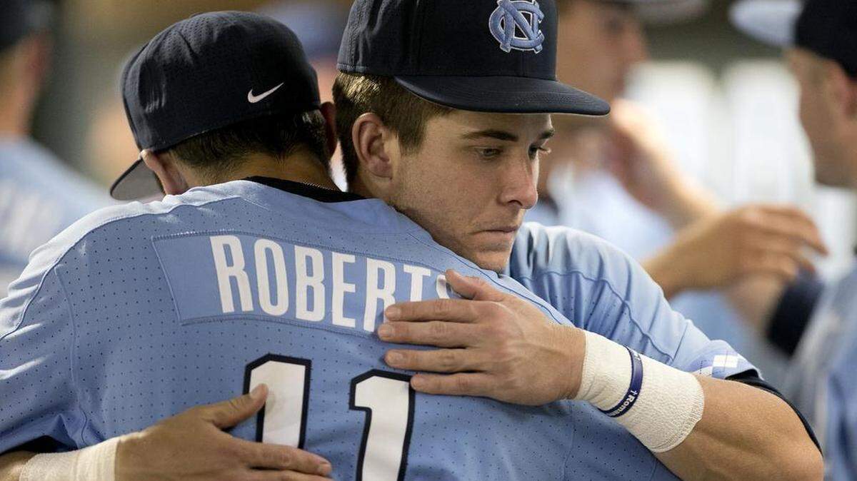 North Carolina’s Logan Warmoth (7) embraces teammate Cody Roberts (11) following their 2-1 season ending loss to Davidson in the NCAA regional on Sunday, June 4, 2017 at Boshamer Stadium in Chapel Hill, N.C.