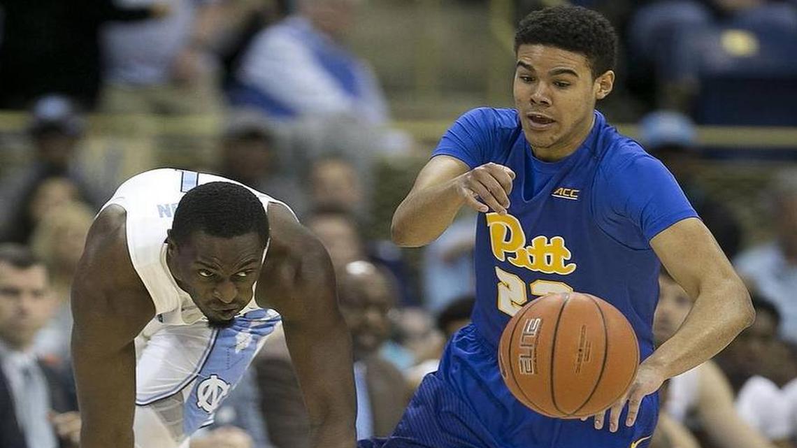 Former Pitt guard Cameron Johnson (right) signed his scholarship agreement at UNC on Friday.