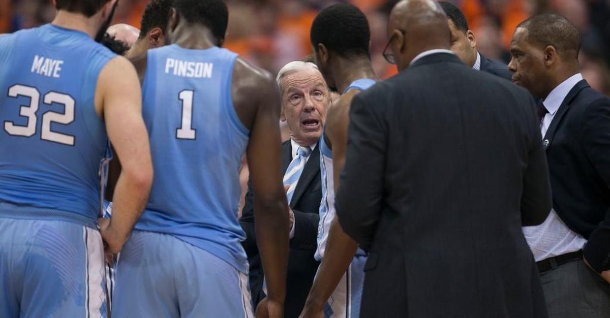 North Carolina coach Roy Williams huddles with his players during the closing minutes against Syracuse on Wednesday, February 21, 2018 at the Carrier Dome in Syracuse, NY.