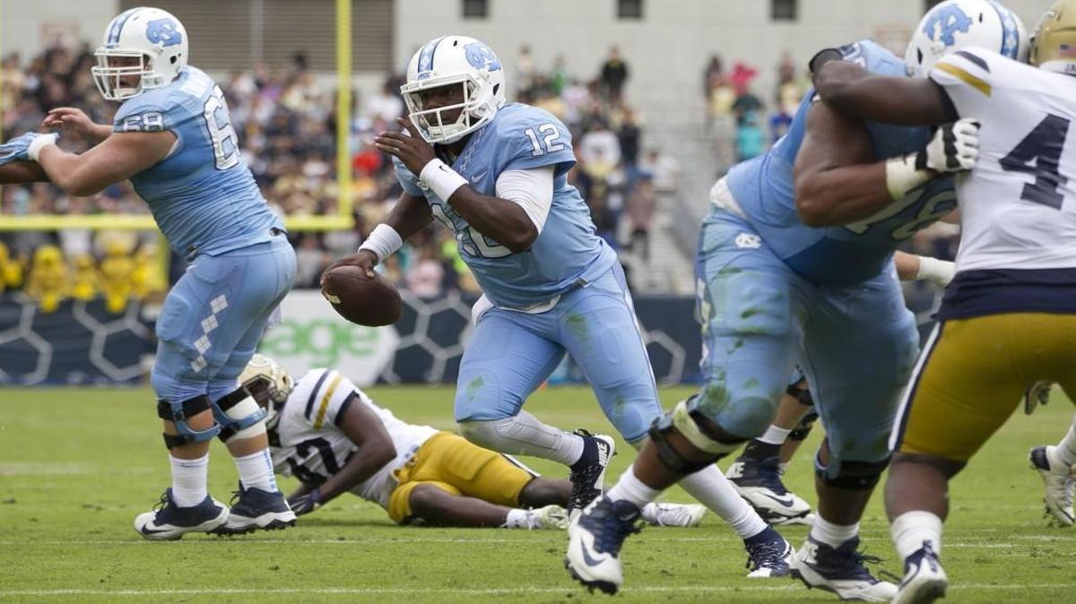 
North Carolina quarterback Marquise Williams (12) scores a touchdown on a 7-yard run in the second quarter against Georgia Tech.
