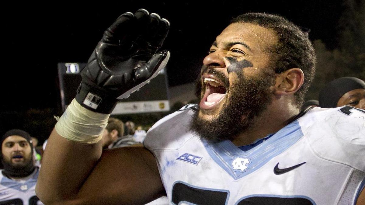 
UNC's Landon Turner (78) and his teammates celebrate their 45-20 victory over Duke on Thursday, November 19, 2014 at Wallace Wade Stadium in Durham, N.C.

