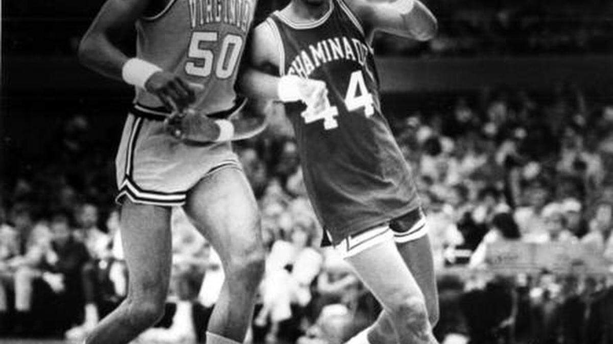 In this Dec. 23, 1982, file photo, Chaminade's Tony Randolph, right, moves around Virginia's Ralph Sampson during an NCAA college basketball game in Honolulu.