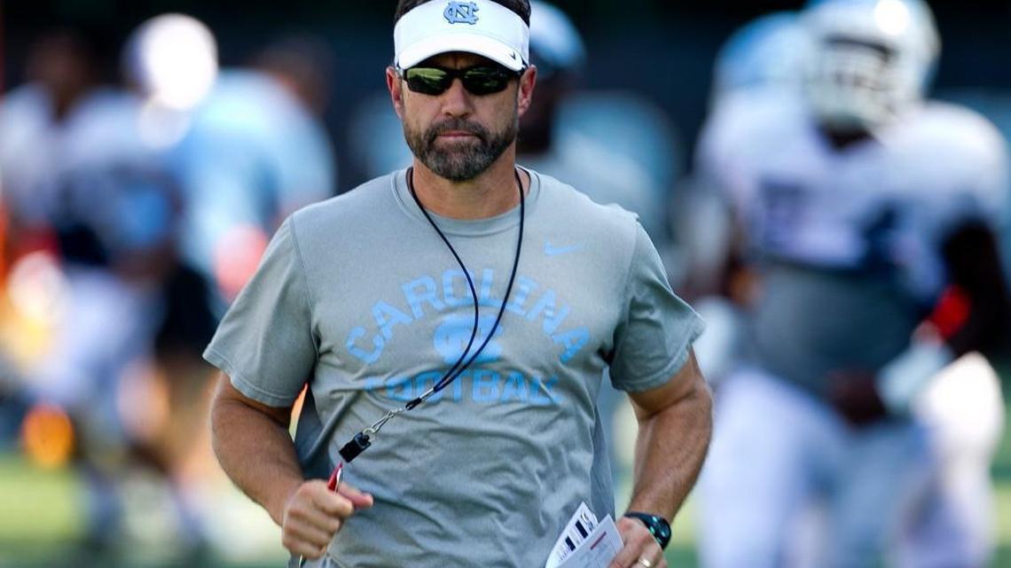 North Carolina football coach Larry Fedora leads his team in drills at practice in 2016.