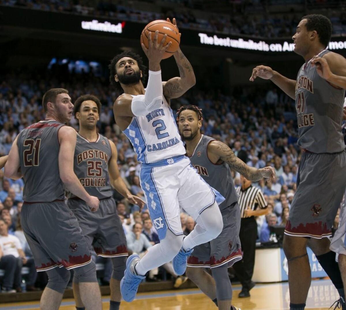 North Carolina’s Joel Berry II (2) break through the Boston College defense during the first half on Tuesday, January 9, 2018 at the Smith Center in Chapel Hill, N.C.