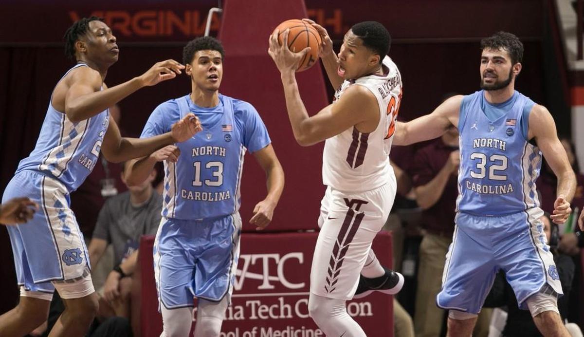 Virginia Tech’s Kerry Blackshear Jr. (24) collects an offensive rebound in the second half surrounded by North Carolina’s Sterling Manley (21), Cameron Johnson (13) and Luke Maye (32) on Monday, January 22, 2018 at Cassell Coliseum in Blacksburg, Virginia.