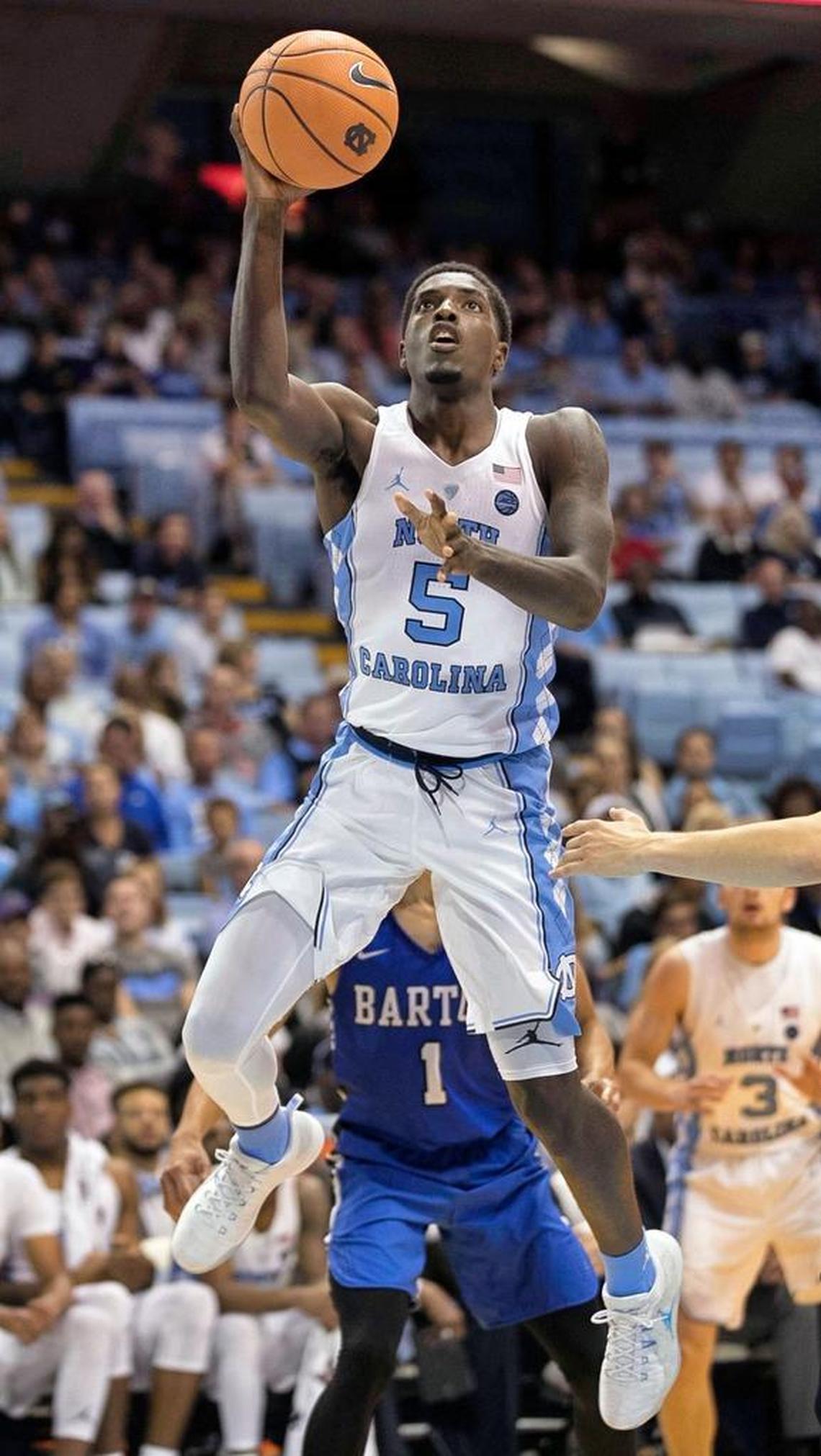North Carolinaís Jalek Felton (5) drives to the basket past Barton Collegeís Matt Woods (1) during the second half.