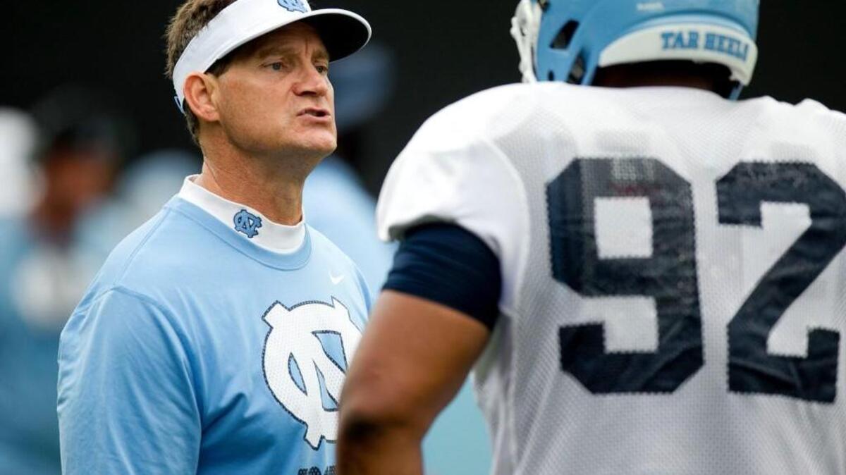 
North Carolina defensive coordinator Gene Chizik instructs Aaron Crawford (92) during the Tar Heels’ practice in August. Chizik and his defense have been practicing for Georgia Tech’s triple option offense since the beginning of the season.


